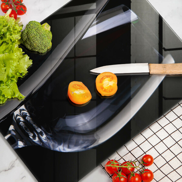 Skärbräda i glas Ett glas och en flaska