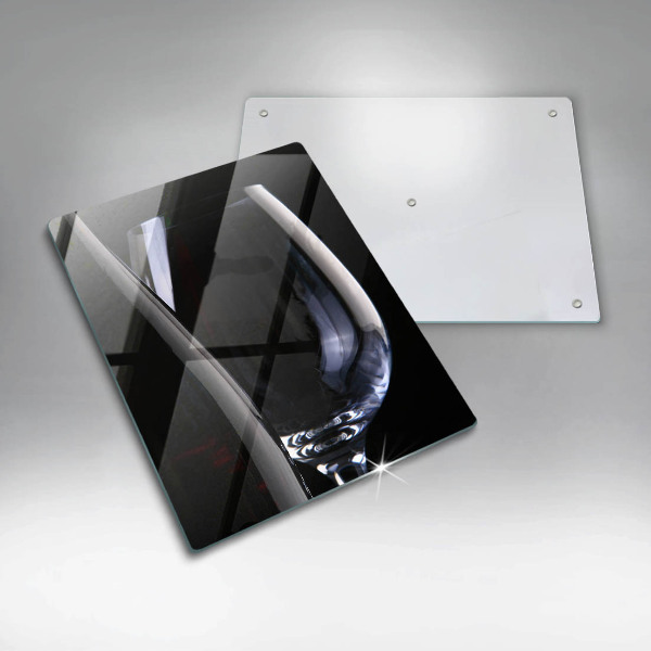 Skärbräda i glas Ett glas och en flaska