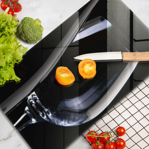 Skärbräda i glas Ett glas och en flaska