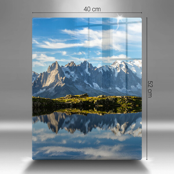 Skärbräda i glas Bergslandskap