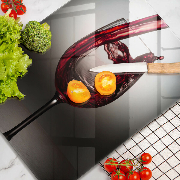 Skärbräda i glas Ett glas och rött vin