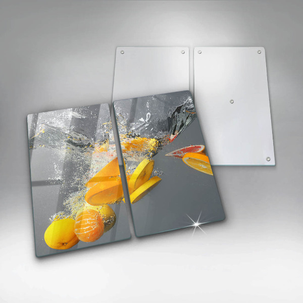 Skärbräda glas Citroner i vatten