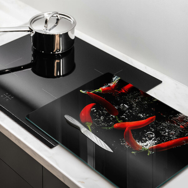 Skärbräda i härdat glas Chilipeppar i vatten