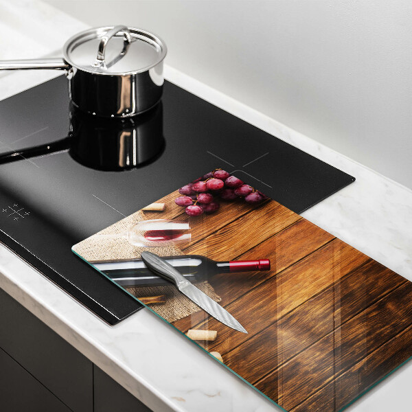 Skärbräda i härdat glas En flaska rött vin