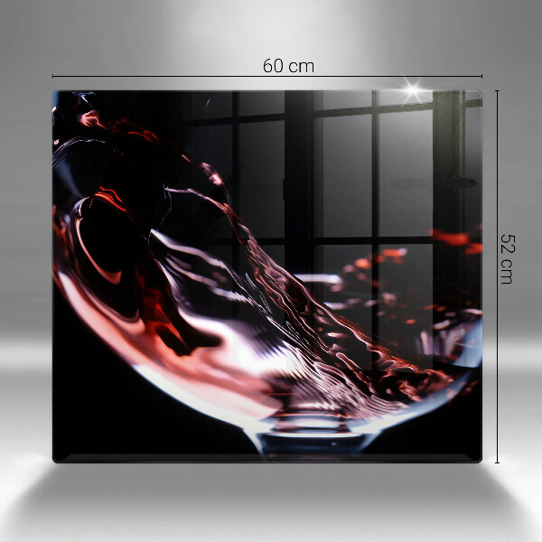 Skärbräda av glas Ett glas rött vin