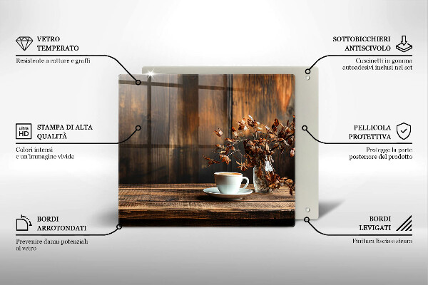 Skärbräda av glas En kopp kaffe och ved