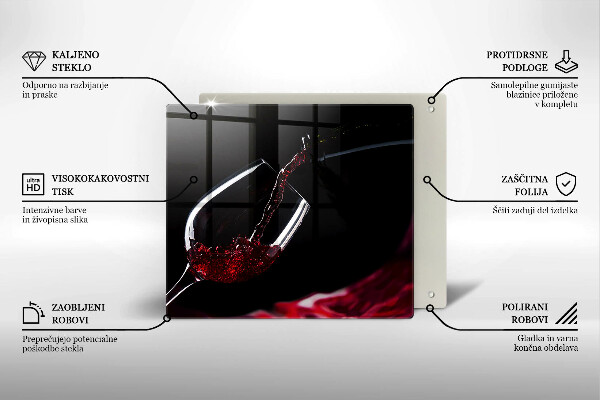 Skärbräda av glas Ett glas rött vin