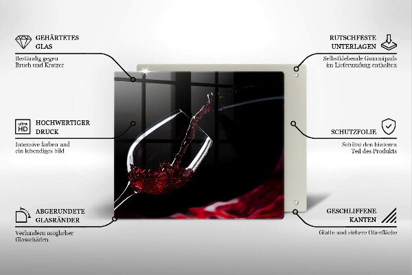 Skärbräda av glas Ett glas rött vin