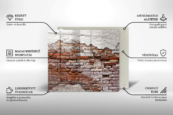 Skärbräda av glas Gammal tegel- och betongvägg