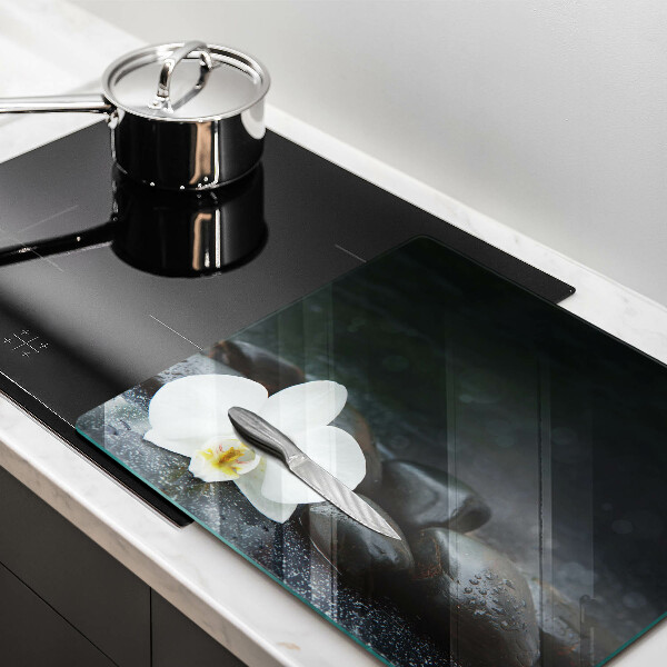 Skärbräda av glas Vita blomma zen stenar