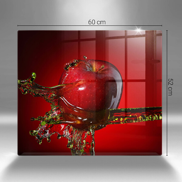 Skärbräda av glas Äppelfrukt i vatten