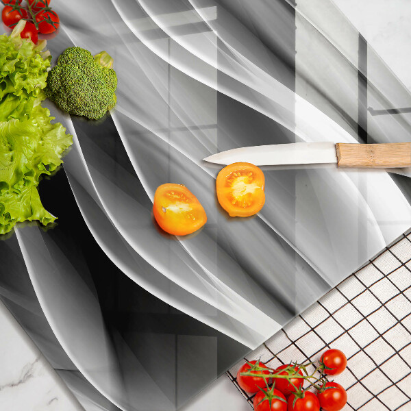 Skärbräda av glas Abstrakta röklinjer