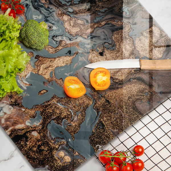 Skärbräda av glas Gyllene stenstruktur