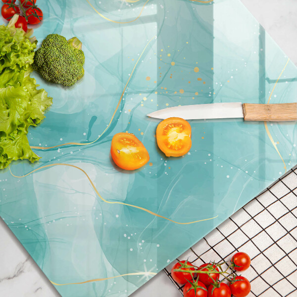 Skärbräda av glas Blå och guld abstraktion