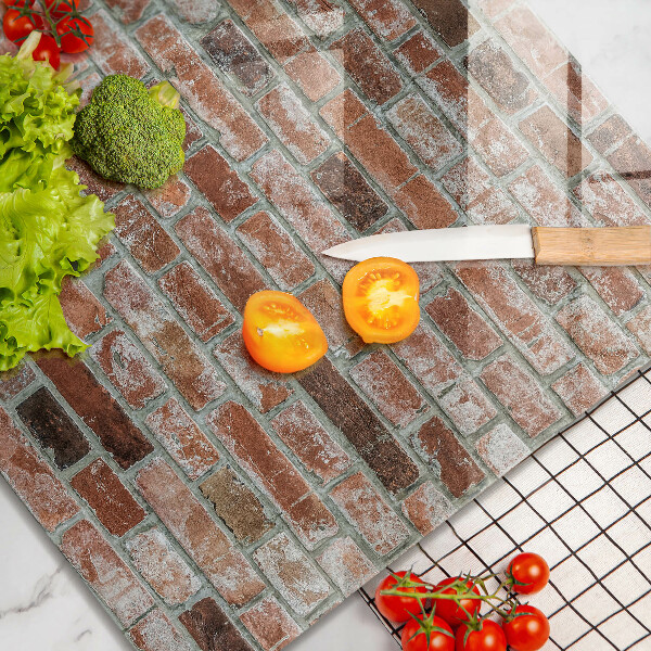 Skärbräda av glas Gammal tegelvägg