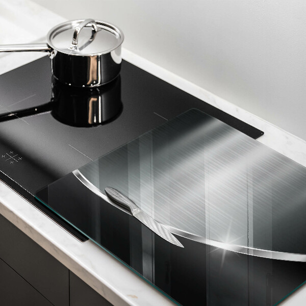 Skärbräda av glas Abstraktion med metall