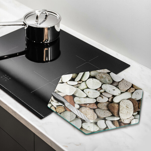 Skärbräda glas sexhörning Små stenar bakgrund