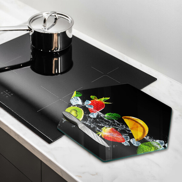 Skärbräda glas sexhörning Frukt i vatten