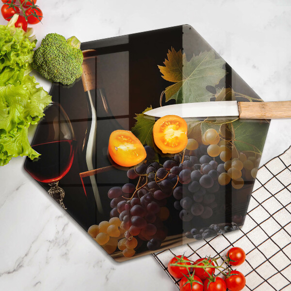 Skärbräda glas sexhörning Glas vin och druvor