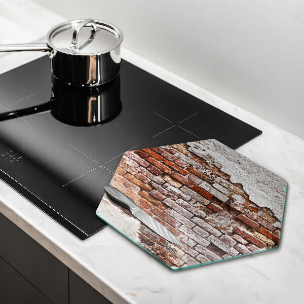 Skärbräda glas sexhörning Gammal tegel- och betongvägg