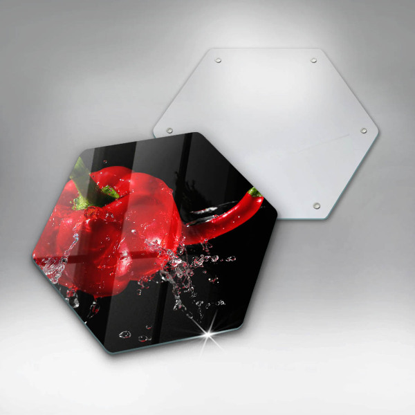 Skärbräda glas sexhörning Röd paprika i vatten