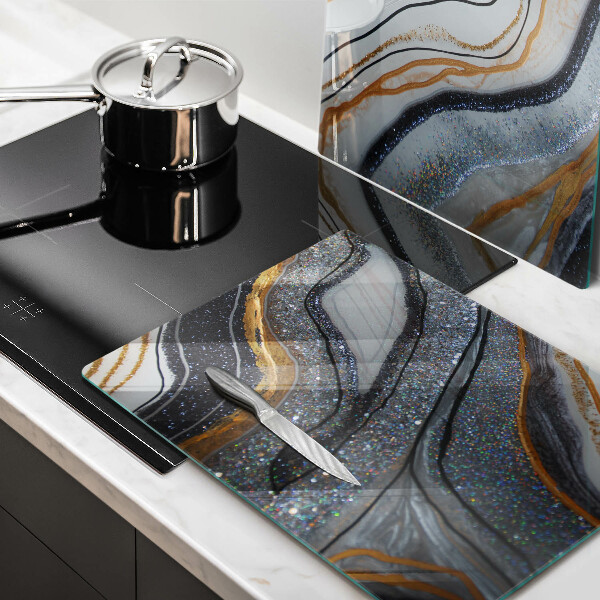 Skydd för induktionsspis sten med guld