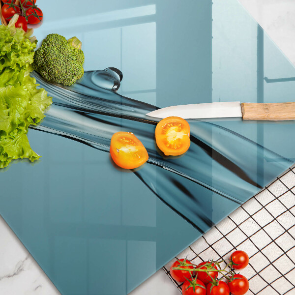 Spisskyddsplatta elegant Vatten på en blå bakgrund