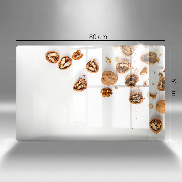 Spisskyddsplatta elegant Nötter på en vit bakgrund