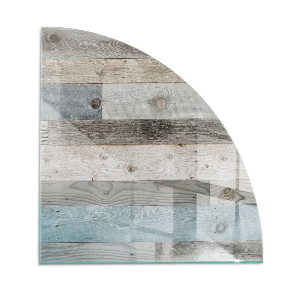 Fjärdedelscirkel glasskiva framför öppen spis Plankor i olika nyanser