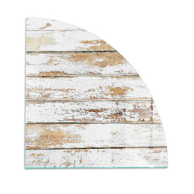 Fjärdedelscirkel glasskiva framför öppen spis Sliten träplanka