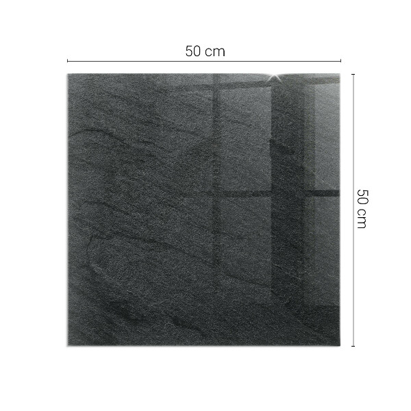 Kvadratisk glasskiva framför öppen spis Stenytans struktur