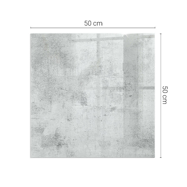 Kvadratisk glasskiva framför öppen spis Rå betongstruktur