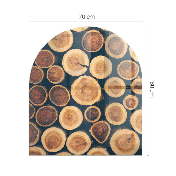 Halvoval glasskiva framför öppen spis Låda med sågat trä