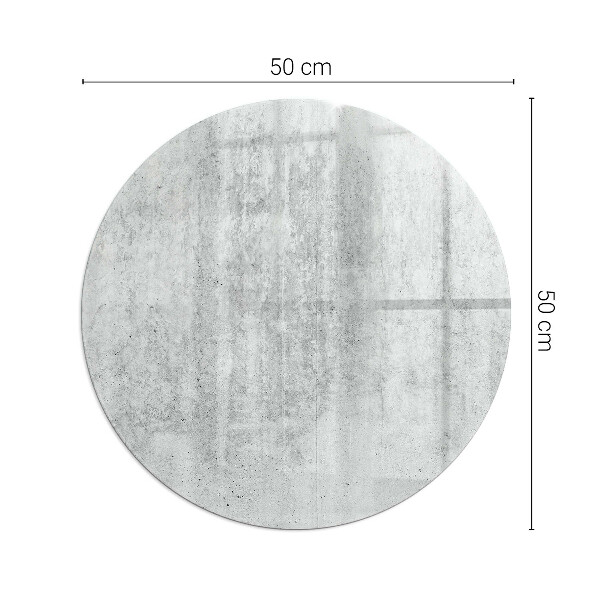Runda glasskiva framför öppen spis Rå betongstruktur