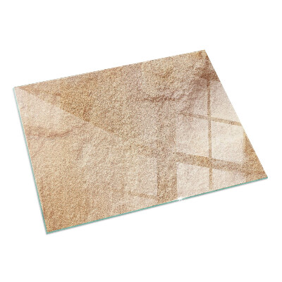 Rektangulär glasskiva framför öppen spis Struktur av natursten