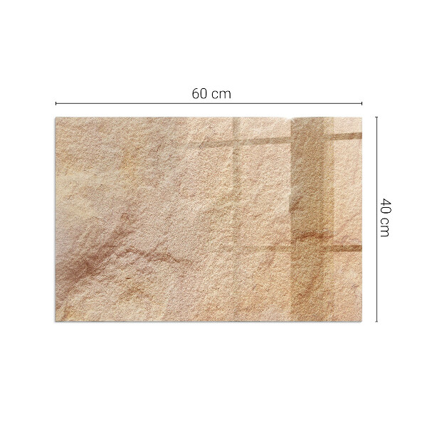 Rektangulär glasskiva framför öppen spis Struktur av natursten