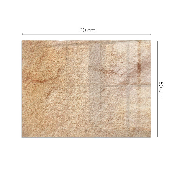 Rektangulär glasskiva framför öppen spis Struktur av natursten