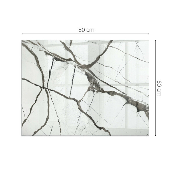 Rektangulär glasskiva framför öppen spis Marmorådringar
